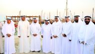 Minister of Culture and Sports H E Salah bin Ghanem Ali Ali (fourth right), Sheikh Faisal bin Qassim Al Thani (fourth left), Katara General Manager Dr Khalid bin Ibrahim Al Sulaiti (third left) and other guests at the opening of Katara 6th Traditional Dho