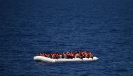 (FILES) This file photo taken on May 24, 2016 shows refugees waiting on a rubber boat to be rescued during an operation at sea with the Aquarius, a former North Atlantic fisheries protection ship now used by humanitarians SOS Mediterranee and Medecins San