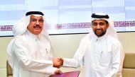 QU President Dr Hassan Al Derham and GOIC Secretary-General Abdul-Aziz H Al Ageel after signing the deal.