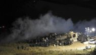 Law enforcement officers surround demonstrators protesting against plans to pass the Dakota Access pipeline during a standoff at the Backwater Bridge in Morton County, North Dakota, U.S., November 20, 2016. Courtesy of Morton County Sheriff's Department/H
