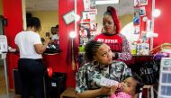 Derricka Welsey gets her hair done on North Avenue in Milwaukee on November 17,2016, one week after President-elect Donald Trump and Vice President Mike Pence won the state of Wisconsin, a state that in the past has been democrat state, and went republica