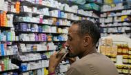 A customer waits for his medicine in a pharmacy in downtown Cairo, Egypt, November 17, 2016. Picture taken November 17, 2016. REUTERS/Mohamed Abd El Ghany