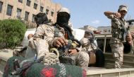Pro-government soldiers ride on the back of a patrol truck at the site of recent clashes between pro-government fighters and Houthi fighters in the southwestern city of Taiz, Yemen November 23, 2016. REUTERS/Anees Mahyoub