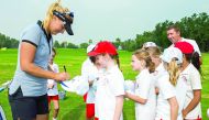 Swedish golfer Anna Nordqvist signs autographs during a coaching clinic for local children on the driving range at the Doha Golf Club yesterday.
