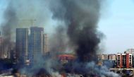 An aerial view shows smoke rising from a fire which broke out at a furniture market in Mumbai, India, November 25, 2016. REUTERS/Shailesh Andrade