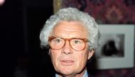 This file photo taken on September 12, 1990 shows British photographer and film director David Hamilton during the opening of his exhibition. British photographer David Hamilton was found dead at his home in Paris aged 83, on November 25, 2016. / AFP / Pi