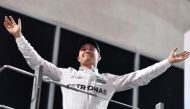 Mercedes AMG Petronas F1 Team's German driver Nico Rosberg celebrates at the end of the Abu Dhabi Formula One Grand Prix at the Yas Marina circuit on November 27, 2016.  AFP / Andrej ISAKOVIC
