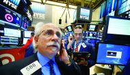 Traders work on the floor of the New York Stock Exchange.