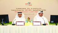 Minister of Energy and Industry H E Dr Mohammed bin Saleh Al Sada and Kahramaa President Eng Essa bin Hilal Al Kuwari at the Annual Planning Forum of Kahramaa, yesterday.
