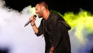 Arab-Israeli rapper Tamer Nafar performs on-stage during a festival in the northern Arab-Israeli town of Sakhnin on October 23, 2016. AFP / AHMAD GHARABLI 
