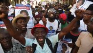 Supporters of Haitian presidential candidate Maryse Narcisse of the Fanmi Lavalas political party march to claim the victory of their candidate in Port-au-Prince, on November 28, 2016. AFP / HECTOR RETAMAL