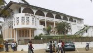 Ivorian boys sit outside the Etoile du Sud hotel in Grand Bassam, Ivory Coast, 14 March 2016 (EPA) 