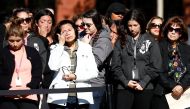 Attendees bow their heads during a memorial event at the Inland Regional Center on the one year anniversary of the San Bernardino attack in San Bernardino, California, U.S. December 2, 2016. REUTERS/Patrick T. Fallon