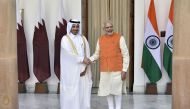 India's Prime Minister Narendra Modi (R) shakes hands with Qatar's Prime Minister HE Abdullah bin Nasser bin Khalifa Al Thani prior to a meeting in New Delhi on December 3, 2016. AFP 
