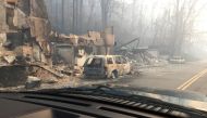 Burned buildings and cars aftermath of wildfire is seen in this image released in social media by Tennessee Highway Patrol in Gatlinburg, Tennessee, U.S. on November 29, 2016. / Reuters.