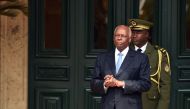 This July 3 2015 photo shows Angola President Jose Eduardo Dos Santos waiting for the arrival of his French counterpart at the presidential palace on July 3 2015 in Luanda (AFP / Alain Jocard) 