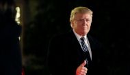 U.S. President-elect Donald Trump gives a thumbs up to the media as he arrives at a costume party at the home of hedge fund billionaire and campaign donor Robert Mercer in Head of the Harbor, New York, U.S., December 3, 2016. REUTERS/Mark Kauzlarich
