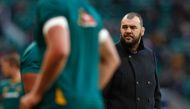 Australia's coach Michael Cheika watches as his players warm up ahead of the international rugby union test match between England and Australia at Twickenham stadium in south-west London on December 3, 2016. / AFP / Adrian DENNIS