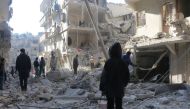 ALEPPO, SYRIA - DECEMBER 04: Search and rescue team members work at site after warcrafts belonging to Syrian army carried out airstrikes on the opposition controlled areas in Aleppo's Sukkeri region, Syria on December 4, 2016. ( Ibrahim Ebu Leys - Anadolu