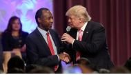 Republican presidential nominee Donald Trump shakes hands with Ben Carson as he attends a church service in Detroit, Michigan, U.S., September 3, 2016.  REUTERS
