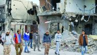 Forces loyal to Libya's UN-backed Government of National Accord (GNA) walk in the Al Giza Al Bahriya area in the former Islamic State (IS) group bastion of Sirte, yesterday.
