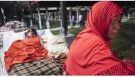 Injured people receive treatment outside a hospital in the quake-devastated area after an earthquake measuring 6.4 on the Richter Scale rocked Pidie Jaya, Aceh, Indonesia on December 08, 2016. (Jefri Tarigan - Anadolu Agency).