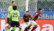Club America forward Silvio Romero (R, #9) reacts following his goal during the Club World Cup football match between Jeonbuk Hyundai and Club America in Suita, Osaka prefecture on December 11, 2016. / AFP / KAZUHIRO NOGI
