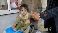 A baby is screened for malnutrition at the UNICEF-supported Al-Jomhouri Hospital in Sa’ada, Yemen. Photo: UNICEF/Ma’ad Al-Zekri
