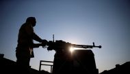 A member of the Iraqi security forces guards a checkpoint near Hammam al-Alil, south of Mosul, Iraq December 11, 2016. REUTERS/Ammar Awad
