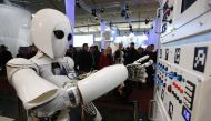 The humanoid robot AILA (artificial intelligence lightweight android) operates a switchboard during a demonstration by the German research centre for artificial intelligence at the CeBit computer fair in Hanover March, 5, 2013.REUTERS/Fabrizio Bensch