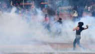 Anti-government demonstrators clash with riot-policemen during a protest against the constitutional amendment PEC 55, which limits public spending, in front of Brazil's National Congress in Brasilia, Brazil December 13, 2016. REUTERS/Adriano Machado
