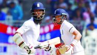 England's Joe Root (right) and Moeen Ali run between wickets during the first day of the fifth Test match at the M A Chidambaram Stadium, Chennai, India, yesterday.