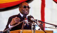 Zimbabwe President Robert Mugabe speaks during the burial of two national heroines, Victoria Chitepo and Vivian Mwashita, at the National Heroes Acre on April 13, 2016 in Harare (AFP / JEKESAI NJIKIZANA) 