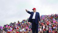 Supporters cheers as US President-elect Donald Trump arrives to speak in Mobile, Alabama, during a ‘Thank You Tour 2016’ rally, yesterday.