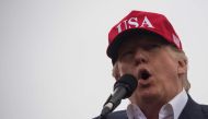 US President-elect Donald Trump addresses a 'Thank You Tour 2016' rally on December 17, 2016 in Mobile, Alabama. AFP / JIM WATSON

