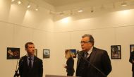 Russian Ambassador to Turkey, Andrei Karlov (R) gives a speech as he visits an art fair at Modern Art Center in Ankara, Turkey on December 19, 2016. Karlov has been shot multiple times at an exhibition in Ankara on Monday evening. (Ecenur Çolak - Anadolu 