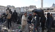 ALEPPO, SYRIA - DECEMBER 20: Civilians from East Aleppo, which was under siege by Assad regime forces and its supporter foreign terrorist groups, wait for their evacuation at Amerriye region of Aleppo, Syria on December 20, 2016. ( Mustafa Sultan - Anadol