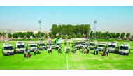 Hamad Medical Corporation’s (HMC) Ambulance Service employees with vehicles and equipment.
