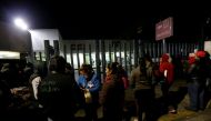 Family members and friends of victims of an explosion at a fireworks market wait outside a hospital in Coacalco, Mexico, December 20, 2016. REUTERS/Henry Romero
