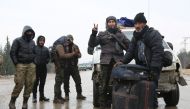 A convoy, evacuating civilians and opposition group members who left east Aleppo that had been under siege by Assad regime and its supporter foreign terrorists, arrive in opposition controlled Rashideen Town of Aleppo, Syria on December 22, 2016 . ( Ahmed