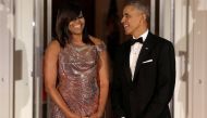 US President Barack Obama and US first lady Michelle Obama speak at their final state dinner. Reuters 