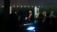 US President-elect Donald Trump (C) exits Mar-a-Lago to attend a church service on Christmas Eve, December 24, 2016 in Palm Beach, Florida. / AFP / Eduardo Munoz Alvarez
