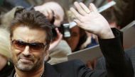 British singer and actor George Michael waves as he leaves a news conference to introduce the film 'George Michael: A Different Story' by Southan Morris which is not part of the competition at the 55th Berlinale International Film Festival in Berlin Febru
