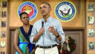 US President Barack Obama addresses troops with First Lady Michelle Obama at Marine Corps Base Hawaii in Kailua, yesterday.