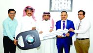 One of the winners of Safari Win 10 BMW 5 series car promotion second lucky draw, Ahmad Saad Ahmad Al Jaham Al Kuwari 
(Coupon No. 1030100), receiving the key from Hamad Dafer Abdulhadi Al Sofan Al Ahbabi, Chairman of Safari Group, and Zainul Abideen, Di