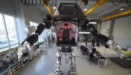 Engineers test a four-metre-tall humanoid manned robot dubbed Method-2 in a lab of the Hankook Mirae Technology in Gunpo, south of Seoul, on December 27, 2016. AFP / JUNG Yeon-Je