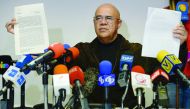 The secretary general of the Venezuelan opposition Democratic Unity Roundtable (MUD), Jesus Torrealba, shows a letter from the Vatican's Secretary of State, Italian cardinal Pietro Parolin, during a press conference in Caracas.