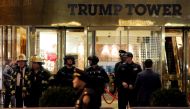 Police and fire crew stand outside Trump Tower following a report of a suspicious package in Manhattan, New York City, U.S., December 27, 2016. REUTERS/Andrew Kelly
