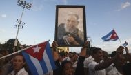 People pay homage to the late Cuban leader Fidel Castro during the last ceremony before his burial in Santiago de Cuba -the cradle of his revolution- on December 3, 2016 (AFP Photo/RODRIGO ARANGUA)