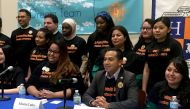 Juana Alejandro (R seated) and her sister Ines Alejandro (R standing) participate in a conference with the 